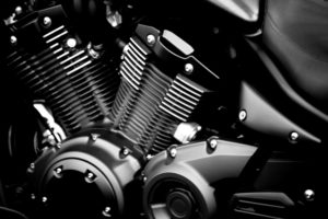 Close-up of a modern black painted engine block of a motorcycle. Close-up of a modern black painted engine block of a motorcycle.
